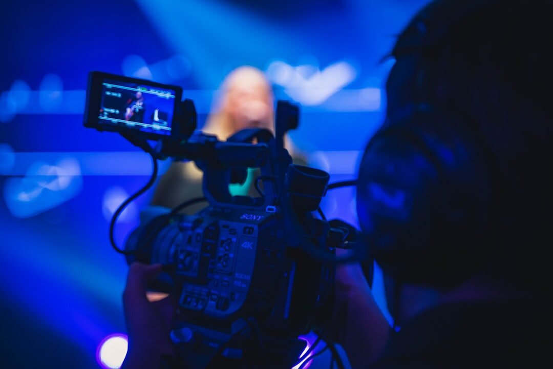 TV news broadcast studio with camera and presenter