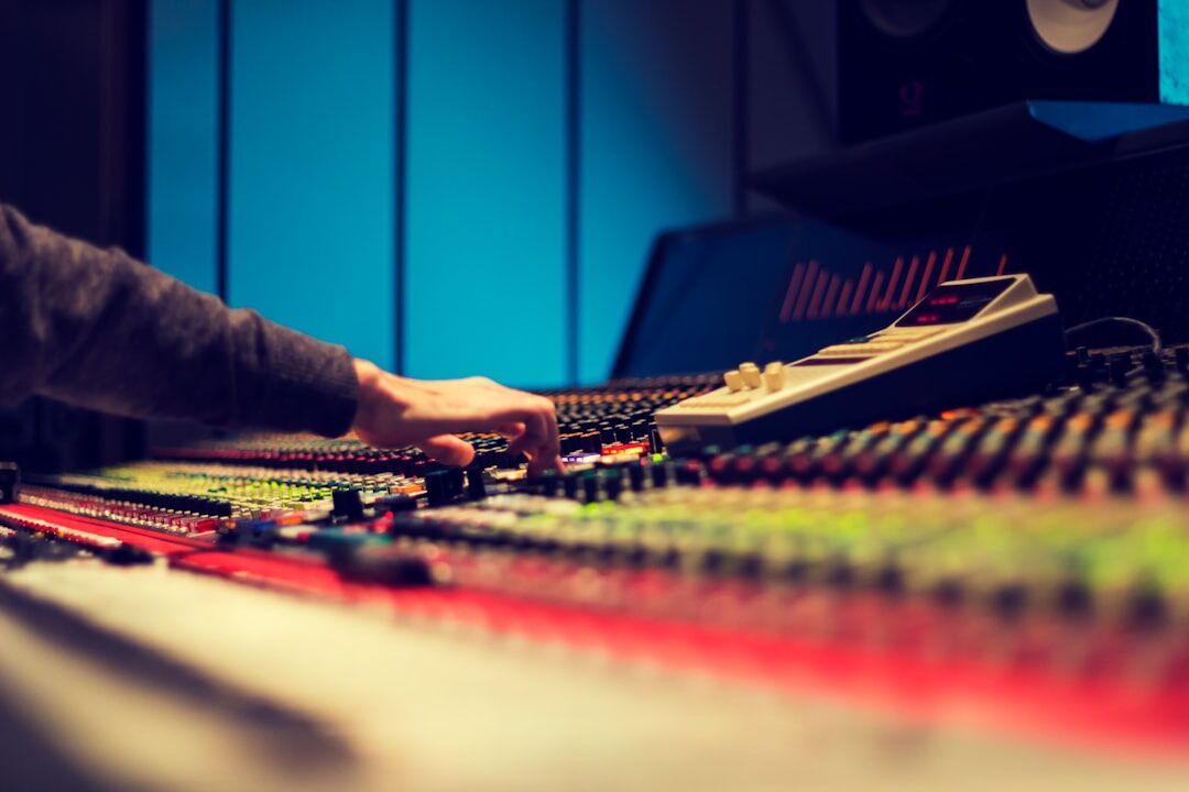 Sound engineer working at audio mixing console