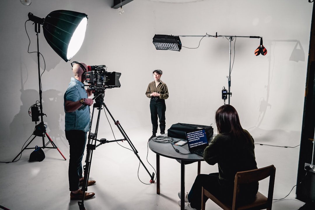 Camera operator filming in a TV studio