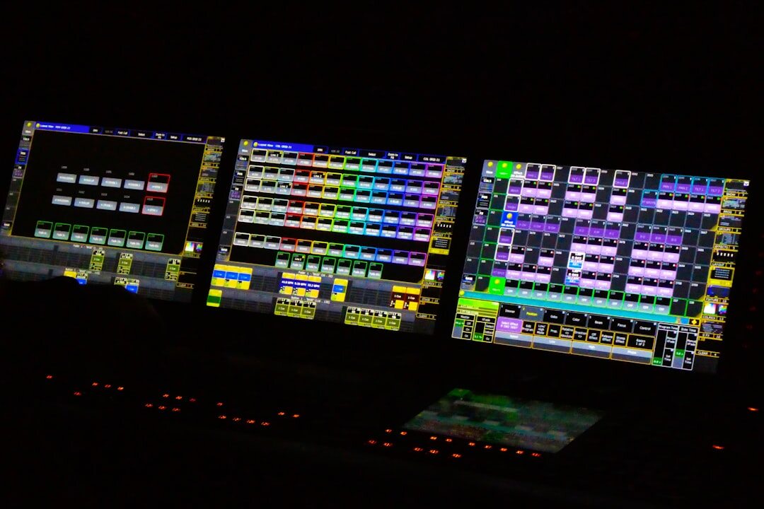 Television broadcast control room with multiple screens